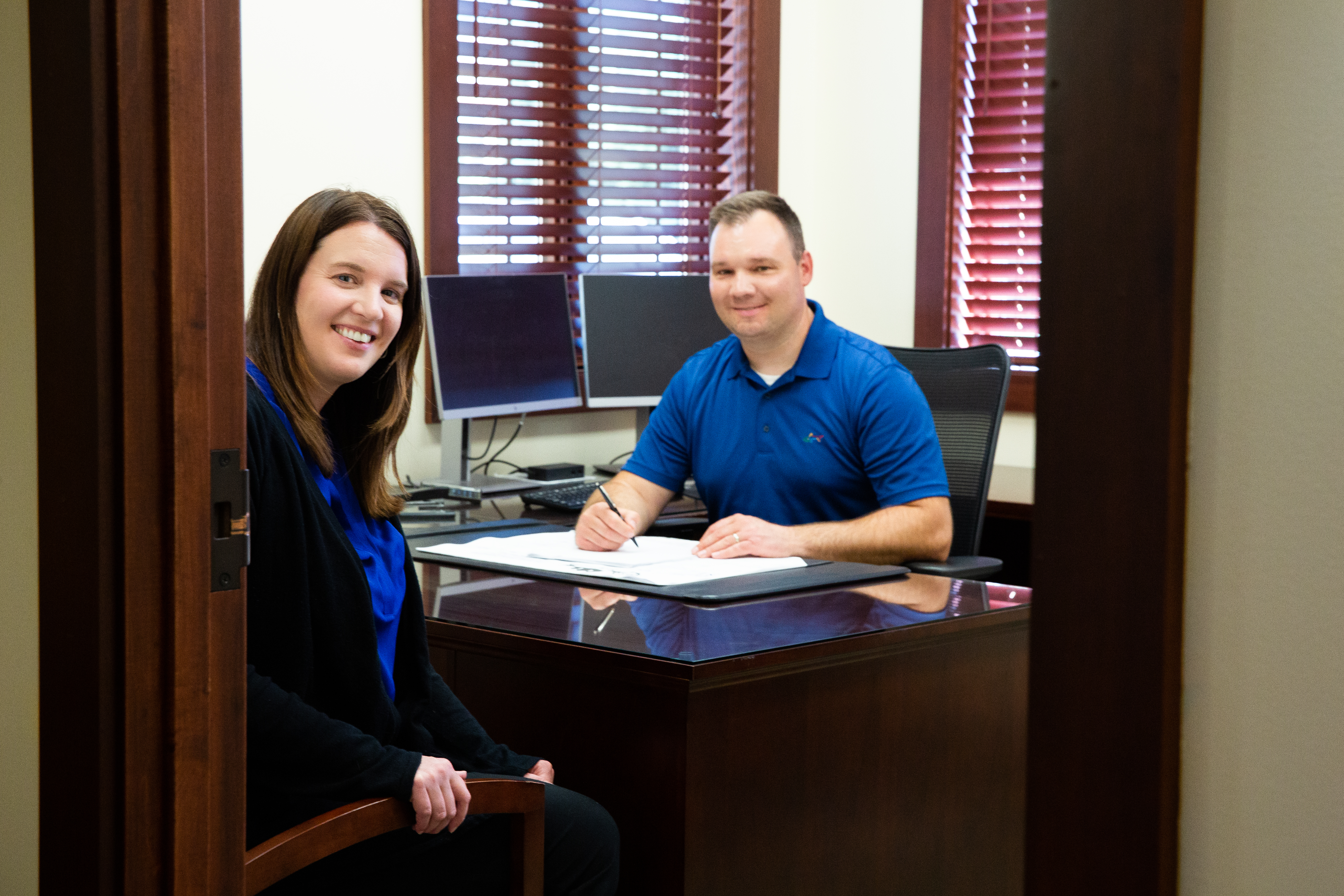 Photo of two bank employees