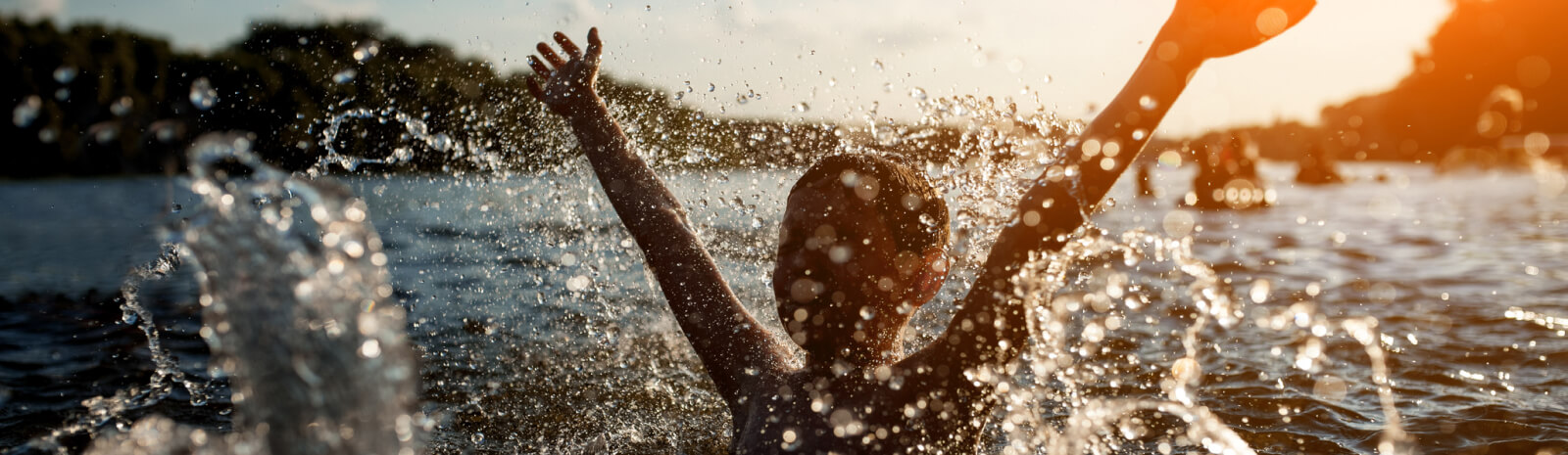Young kid swimming in a lake