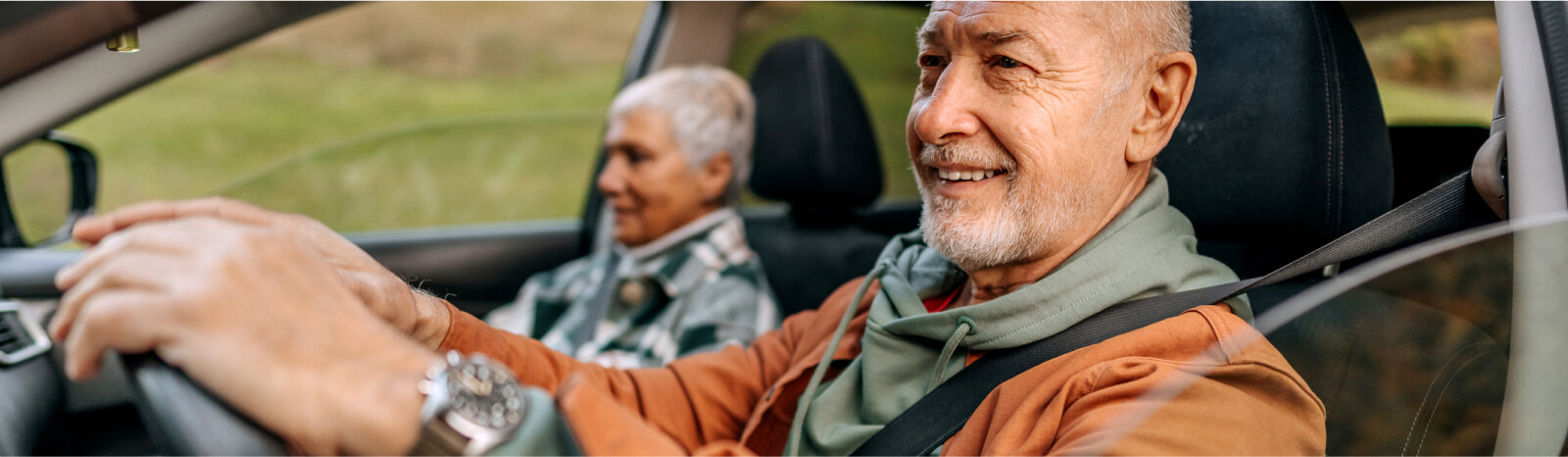 Older man and woman in a car